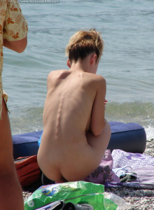 Exciting nude beach girls getting tan